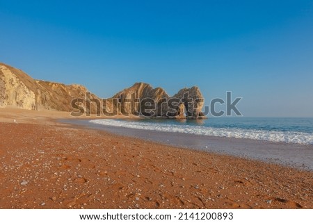 Durdle Door, Dorset, Jurassic Coast, England, UK, Cliffs and rocks around the beach.