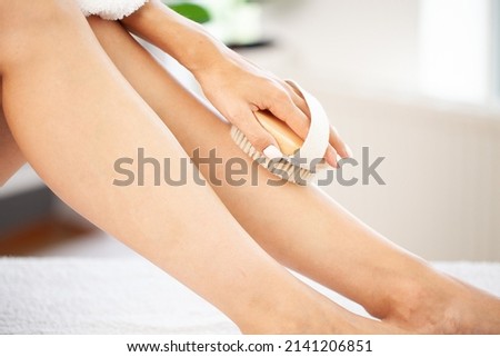 Closeup photo of young woman making a scrub massage