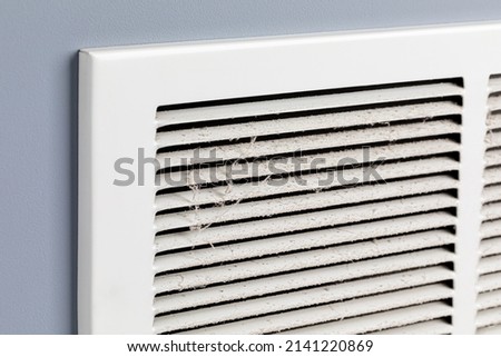 Dirty air vent in house. Household allergies, HVAC duct cleaning, maintenance and house cleaning concept. Royalty-Free Stock Photo #2141220869