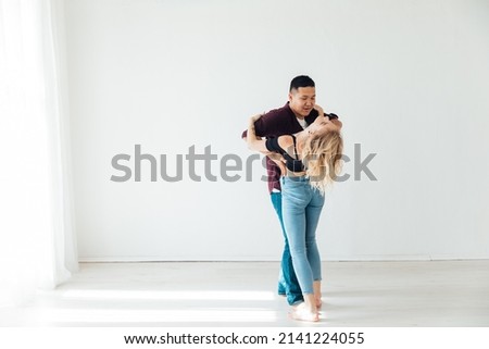 a man and a woman dance together a bachata dance