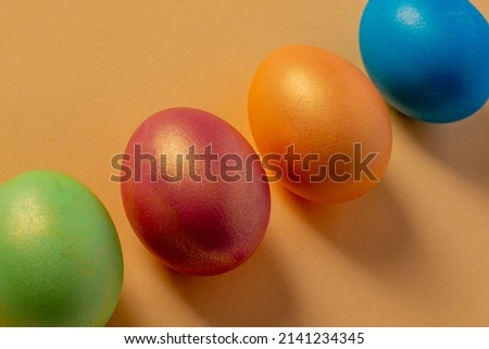 colored painted eggs on a yellow background