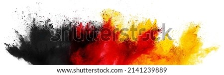 colorful german flag black red gold yellow color holi paint powder explosion isolated on white background. germany europe celebration soccer travel tourism concept Royalty-Free Stock Photo #2141239889