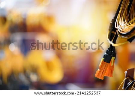 Plastic connector of wiring harnesses. Industrial background with copy space. Automobile industry theme. Royalty-Free Stock Photo #2141252537