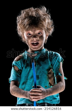 Portrait of funny little electrician over black background