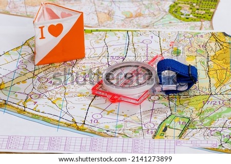 Sport orienteering compass professional, topographic map, symbol of orienteering - prism with symbol I love Royalty-Free Stock Photo #2141273899
