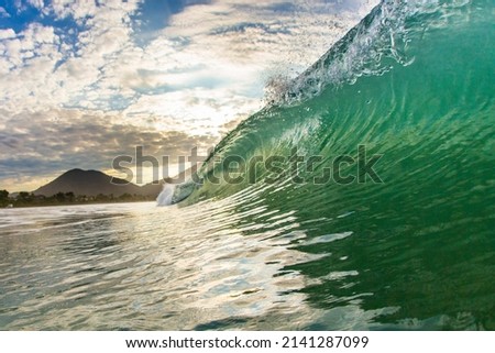 wave on ocean shorebreak sunset green sea