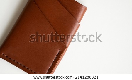 Empty men's business handmade leather card holder with isolated on white background. Selective focus, copy space, close up.