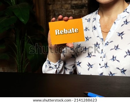Business concept meaning Rebate with sign on orange business card.
