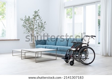 Wheelchair in the living room Royalty-Free Stock Photo #2141307183