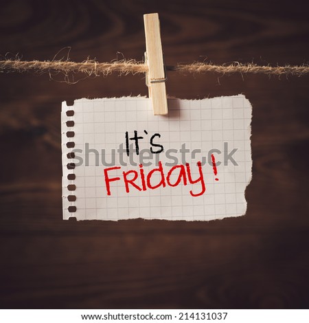 Its Friday. Paper attach to rope with clothes pins on wooden background with text Its Friday.