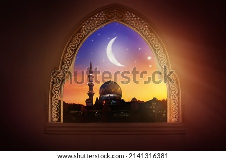 Ramadan Kareem greeting. Islamic city with mosque skyline, crescent moon and stars. View from a window. End of fasting. Hari Raya card. Eid al-Fitr. Breaking of holy fast day. Muslim holiday.  Royalty-Free Stock Photo #2141316381