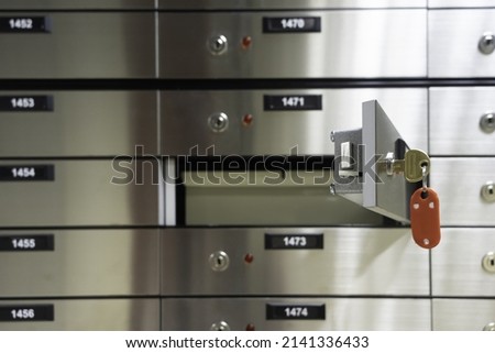 Depository cells. Opened deposit box with key Royalty-Free Stock Photo #2141336433