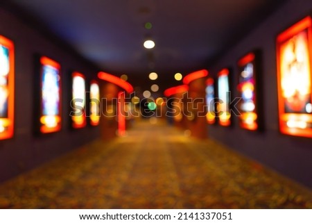 Movie theater entrance interior blur image use for background of business and cinema concept. Abstract blurred image of lobby of movie theater in Vietnam. Royalty-Free Stock Photo #2141337051