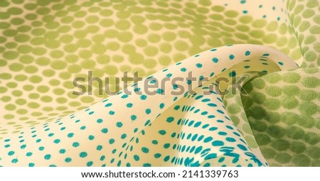 silk fabric Blue and green, pattern with polka dots on a beige background. Texture. for web design, desktop wallpaper, winter blog, website or invitation card.