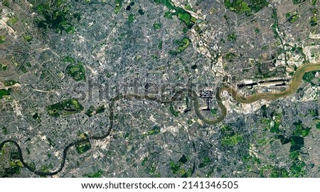 Top view of London, the Capital city from space, London map, Aerial view of Hyde Park, Buckingham Palace, Kensington Gardens, River Thames, grids. Elements of this image furnished by NASA. Royalty-Free Stock Photo #2141346505