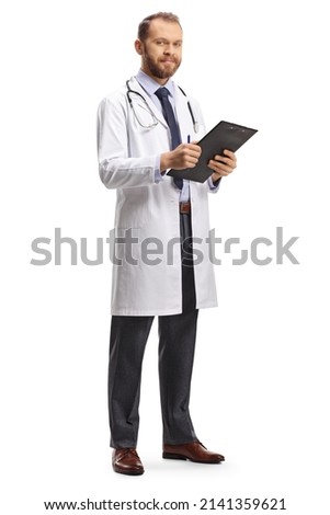 Young male doctor holding a clipboard and looking at camera isolated on white background Royalty-Free Stock Photo #2141359621