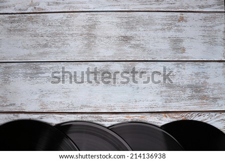 Records on paper bags on wooden background