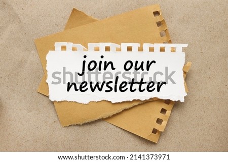 JOIN OUR NEWSLETTER text on torn white paper on brown background
