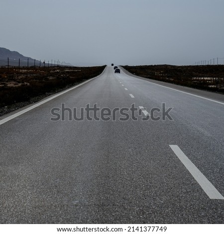 Empty Asphalt road with mountains.