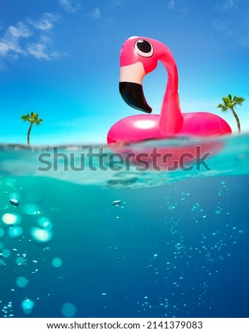 Inflatable flamingo rubber buoy and sea underwater split photo with air bubbles Royalty-Free Stock Photo #2141379083