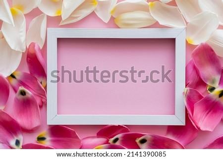 top view of frame on white and pink floral petals