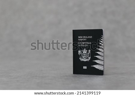 New Zealand passport on gray background