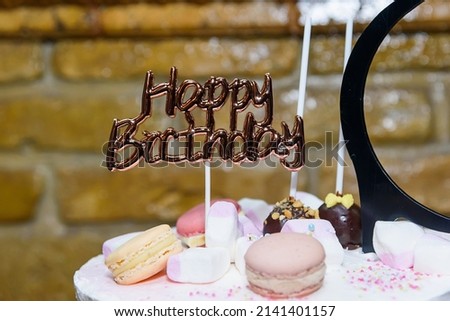 Birthday cake with happy birthday banner. A cake to celebrate coming of age