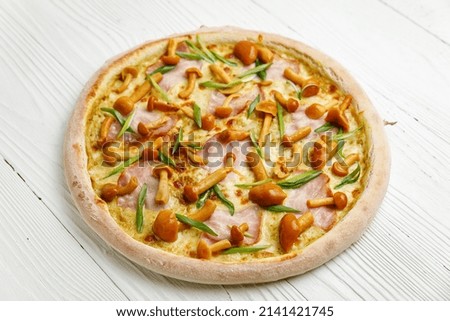 Italian pizza on a white wooden table
