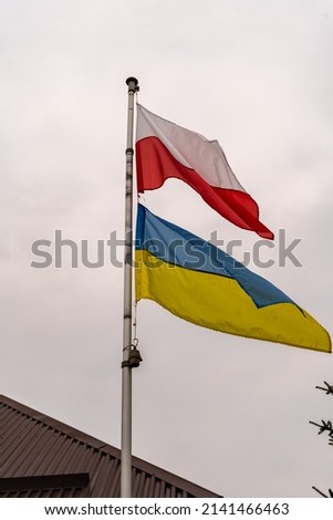 Polish and Ukrainian flags by the polish house to express support for Ukraine in the Russian war. Polish people supporting their neighbours and openly and proudly shows that with flags.