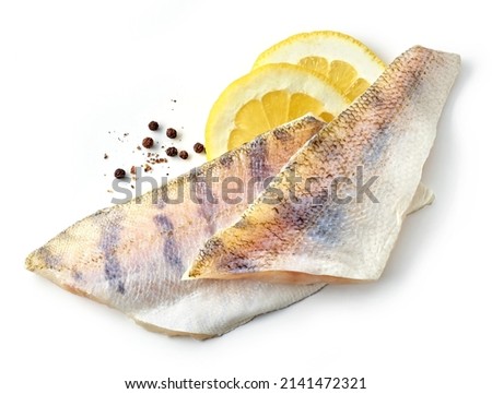 fresh raw zander fish filet with lemon and pepper isolated on white background, top view Royalty-Free Stock Photo #2141472321