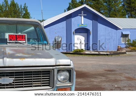 Car for sale and church, Oregon, USA