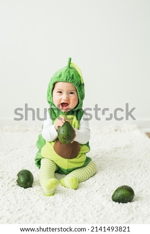 Adorable Cute Little Toddler Girl Daughter Sweet Avocado Costume Halloween Smiling Royalty-Free Stock Photo #2141493821
