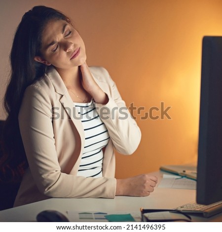This is not what I signed on for. Shot of a young businesswoman experiencing strain during a late night at work.
