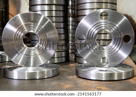 Set of steel flanges for pipeline equipment. Royalty-Free Stock Photo #2141563177