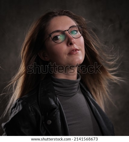 Close-up shot of a young attractive woman in her mid 20s - studio photography