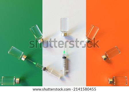 Syringes and medical vials on the flag of Ireland. Vaccination related conceptual 3D rendering