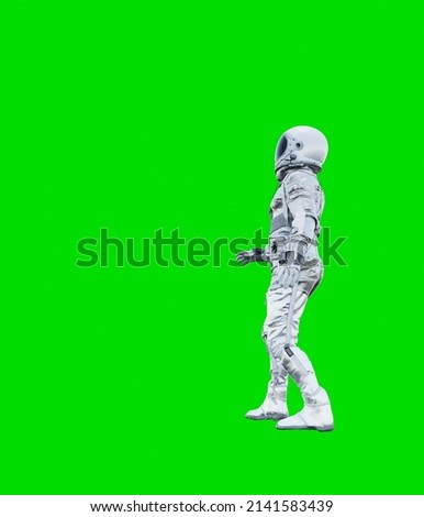 Astronaut isolated on a green background. perfect for compositing.