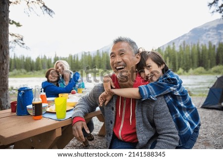 Family relaxing together at campsite