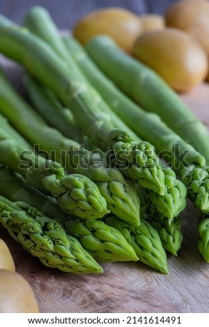 fresh green asparagus and potatoes, uncooked