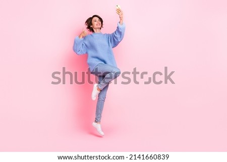 Full size photo of attractive person make selfie photographing show thumb up isolated on pink color background