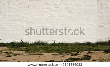 white urban wall background in an empty lot