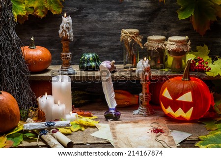 Table in witch hut with halloween pumpkin