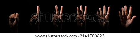 Black counting hands from one to five, isolated over black background
