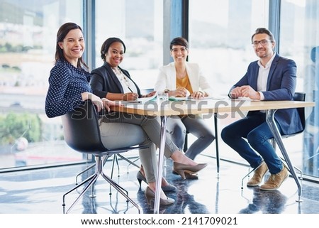 Where great projects are brought to life. Portrait of a team of colleagues having a meeting in an office. Royalty-Free Stock Photo #2141709021