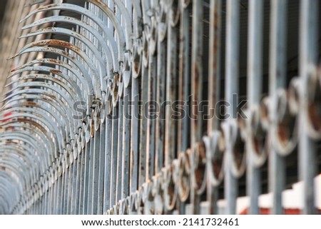 Fence, Chain, Large security spikes installed on a tall building viewing platform, steel spiked security fence
