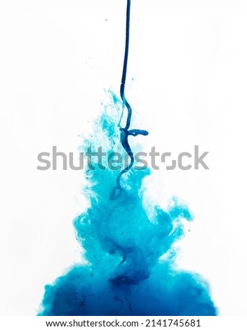 blue ink pours in and dissolves in water. Blue paint splash. Abstract background with copy space and place for text, selective focus. External influence concept.