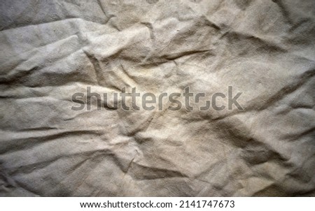 Photo of the texture of old burlap. The background is made of gray vintage fabric. An artistic background for a still life made of fabric.