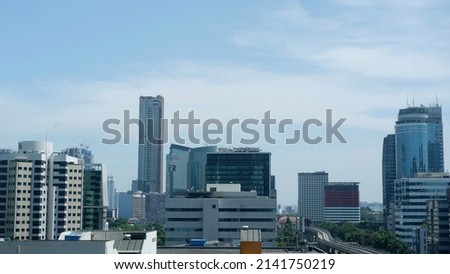  Jakarta downtown and central business district against blue sky background 