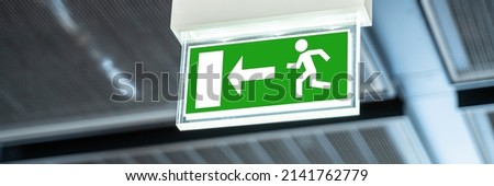 Emergency Evacuation Exit Sign. Fire Caution Label