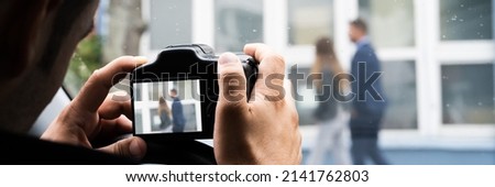 Private Detective Spying. Investigation And Surveillance With Camera Royalty-Free Stock Photo #2141762803